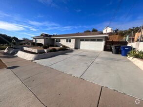 Building Photo - UPDATED 4br/2ba HOME w/ attached GARAGE in...