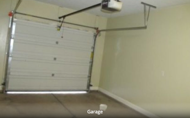 One car garage with shelving. - 1288 N Cedar Blvd. #43