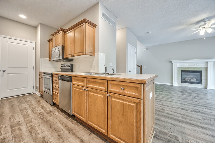 Kitchen sink overlooking living room - 22810 West 71st Terrace