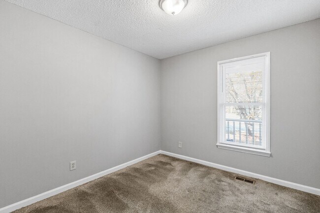 Building Photo - NE Home - Updated Kitchen and Bathrooms!  SS Appliances, Fire Place, Front Porch & Deck, Fenced Y...