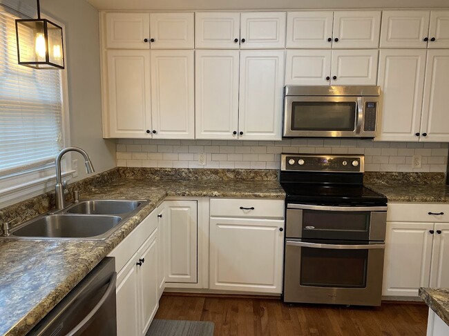 kitchen with built in microwave and double oven - 3705 Pfost Ave