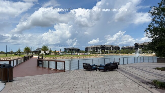 Building Photo - EXCEPTIONAL AND SPACIOUS FURNISHED TOWNHOME WITHIN WATERSIDE- NAUTIQUE!