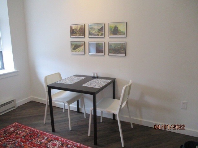 Dining area includes small table and two chairs - 818 12th St
