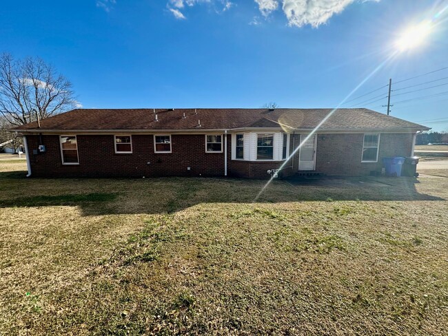 Building Photo - Well maintained brick home on a nice corne...