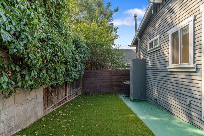 Building Photo - Stylish 2-Bedroom Retreat with Private Yar...