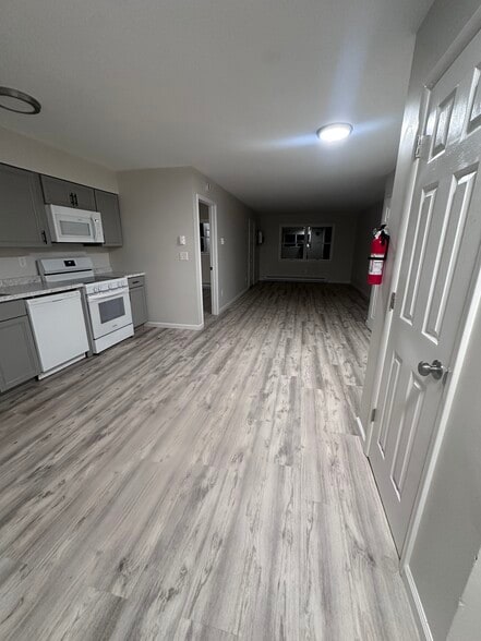 Eat in kitchen with open floor plan to living room - Saugerties Cove View Apartment Homes