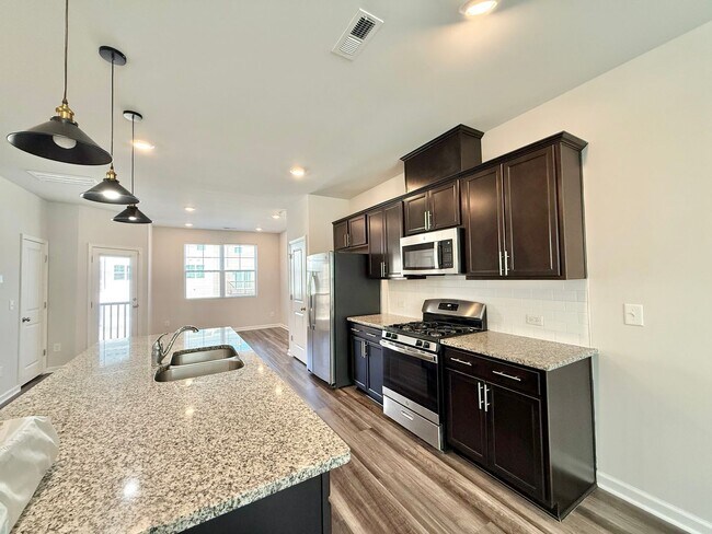 Building Photo - **OFFERING WAIVED APPLICATION FEES & $200 MOVE IN PROMOTION** Stunning 3BD, 2.5BA Raleigh Townhom...
