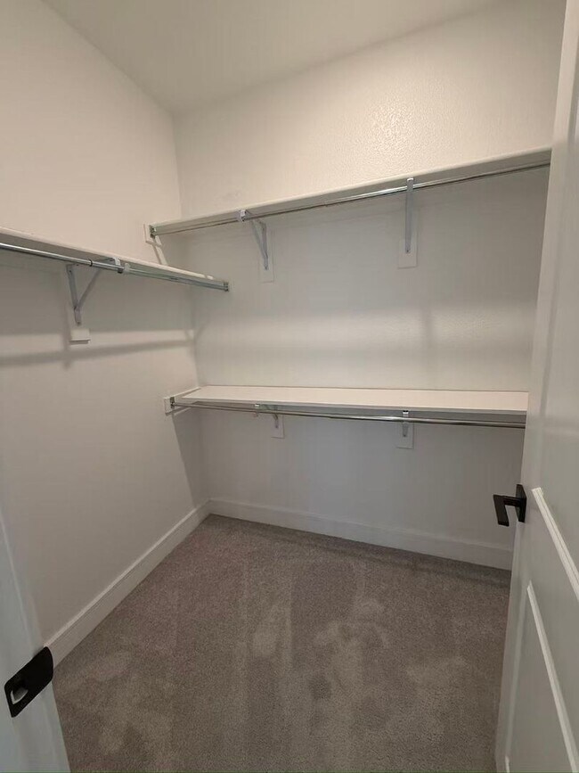 Building Photo - Move-in ready and like-new! Washer, dryer, and refrigerator Included.