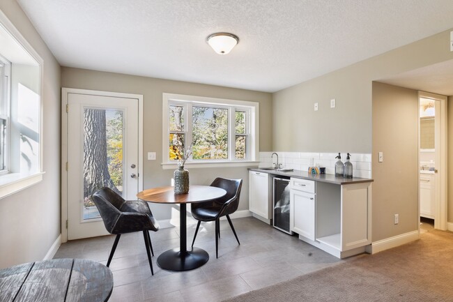 The lower level wet bar area comes in handy when entertaining - 207 Benton Ave