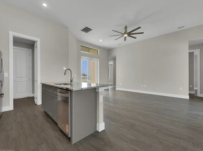 Building Photo - Almost New Construction Waterfront Home in NE Cape Featuring A Pool, Fenced Yard & More! COMING SOON