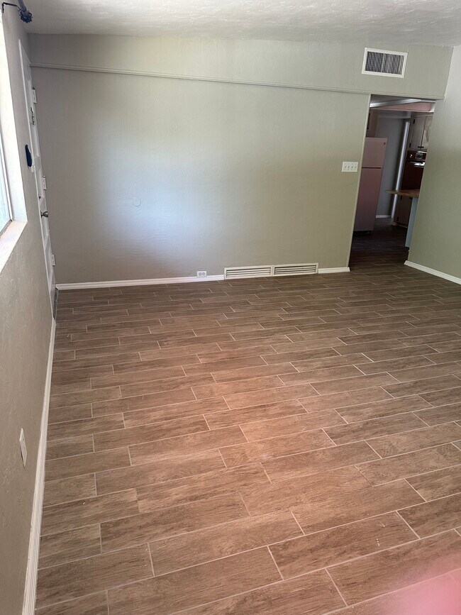 Living room looking into kitchen - 1315 E Adams St