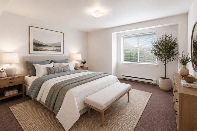 A cozy and inviting bedroom designed for comfort and relaxation. - Villas at Lawrence