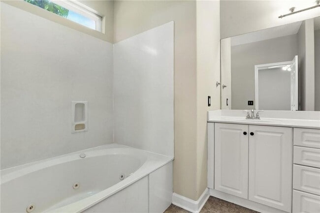 Building Photo - 4-Bedroom Home in Wild Heron with Front Porch and Fenced Yard