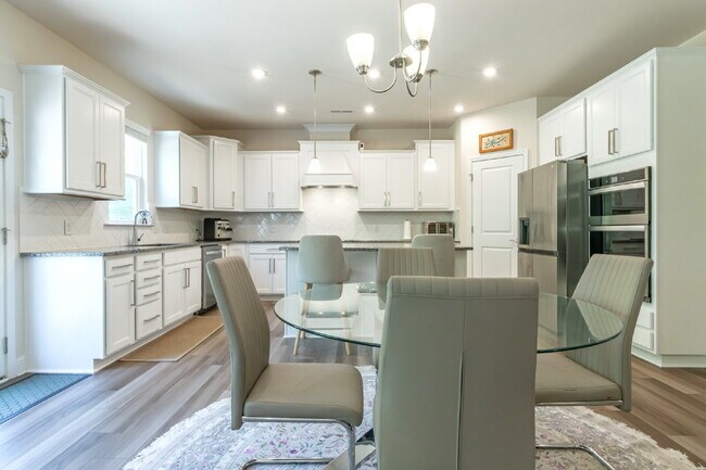 Building Photo - "Discover Spacious Living: 5-Bedroom Craftsman Home in Gated and Amenity-Rich Bretagne with Top-R...