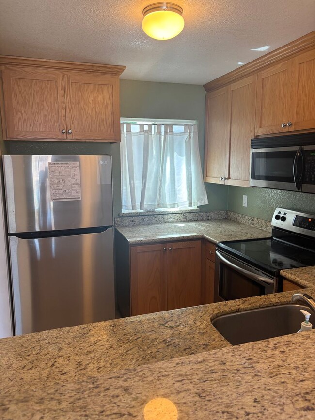 Building Photo - Charming Two-Bedroom, Two-Bath Duet in Pri...