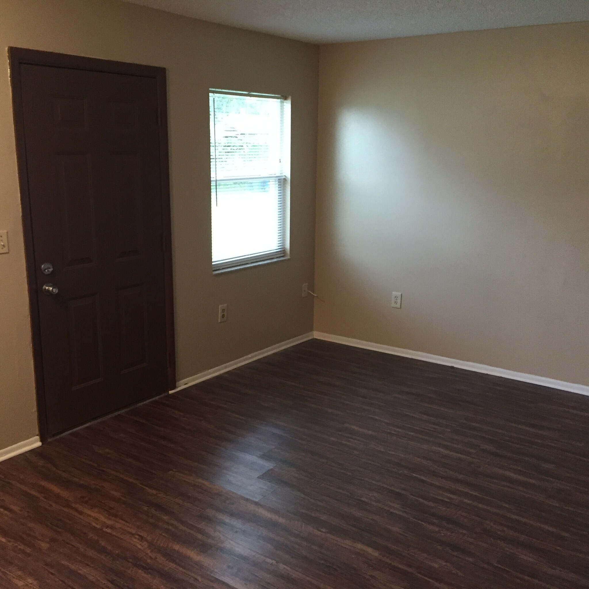 Living room / dining area with vinyl plank flooring. - 2410 S San Gully Rd