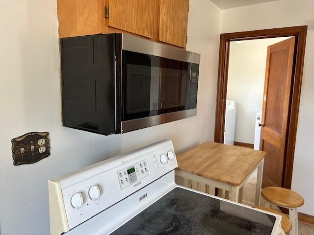 Kitchen includes dishwasher, fridge, microwave, stove, garbage disposal. - 101B N Mill St