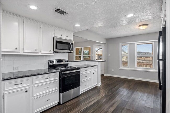 Building Photo - Welcome to this fully remodeled 4/2/2 brick home near Lake Conroe! With new AC/heat, roof, water ...