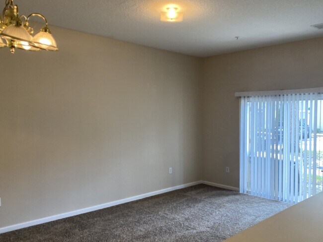 Building Photo - First-Floor 2BR/2BA Condo in Gated Nature’s Hideaway – Pool, Playground & Convenient Westside Loc...