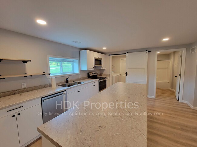 Kitchen facing laundry room and main bathroom - 1566 Sugar Grove Rd