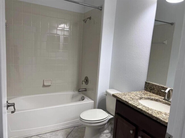 Building Photo - "Spacious 5-Bed Retreat with Elegant Hardwood & Granite Finishes in Tampa – 3 Full Baths & 3264 S...