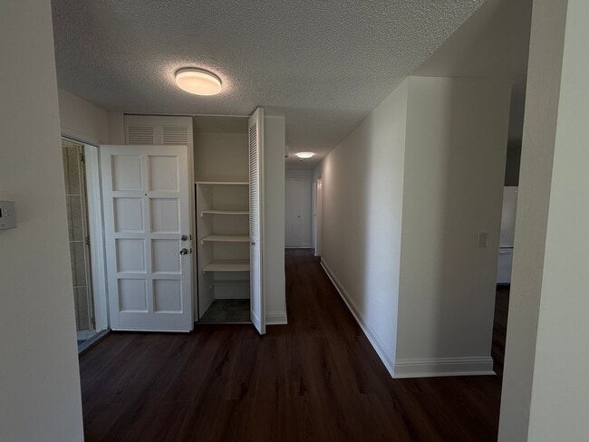 Building Photo - Recently updated home with new floors, paint & bathroom!