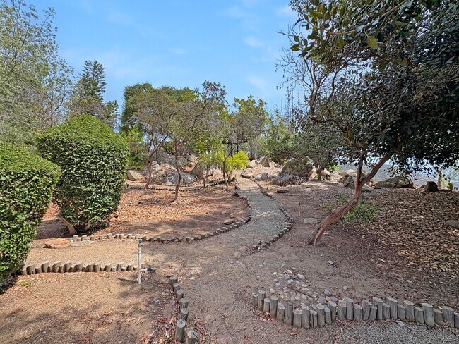 Building Photo - Hilltop Retreat with Pool, Garden & Panora...