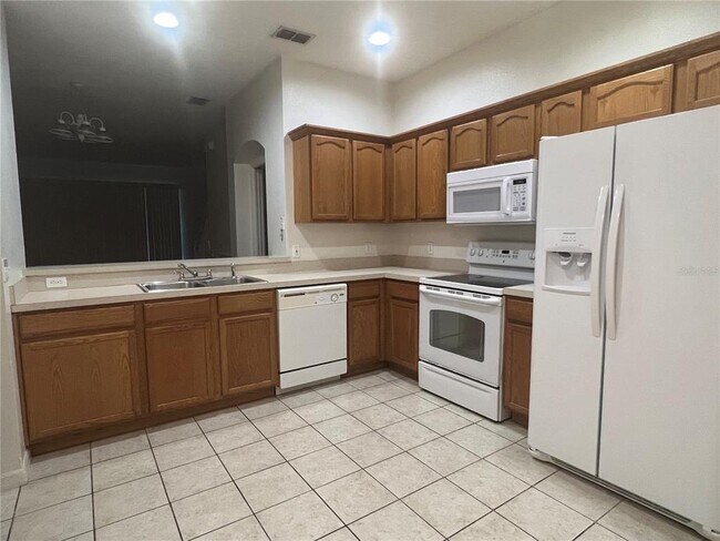 Building Photo - 9806 Fan Palm Way