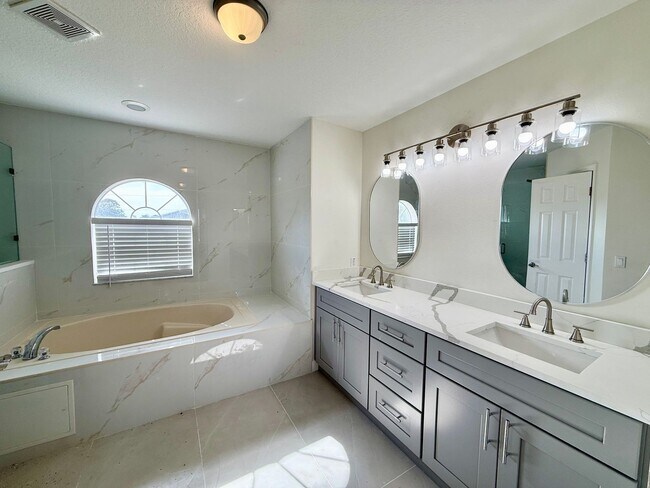 Building Photo - GORGEOUS, Large Completely Renovated Two-Story 4/2.5 PLUS LOFT in POINCIANA VILLAGES!