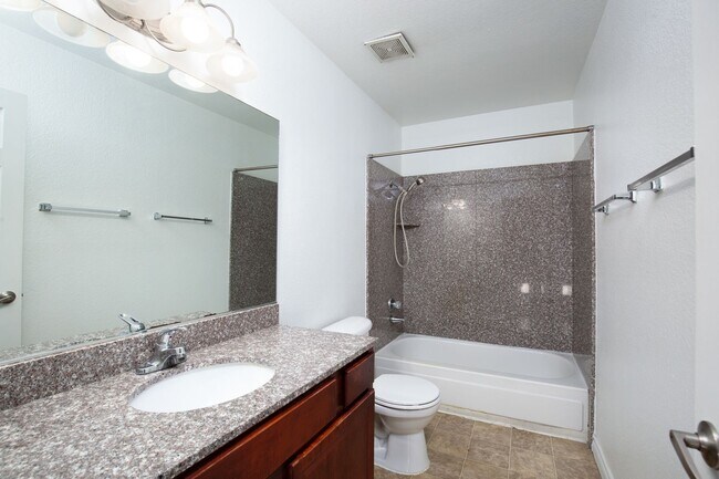 Building Photo - Guard gated SW community with easy Strip a...