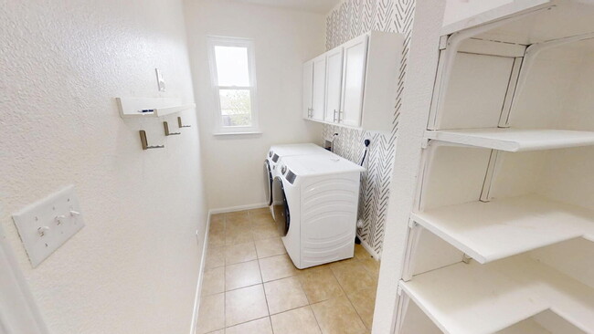 Building Photo - Expansive Living and Stylish Updates in So...