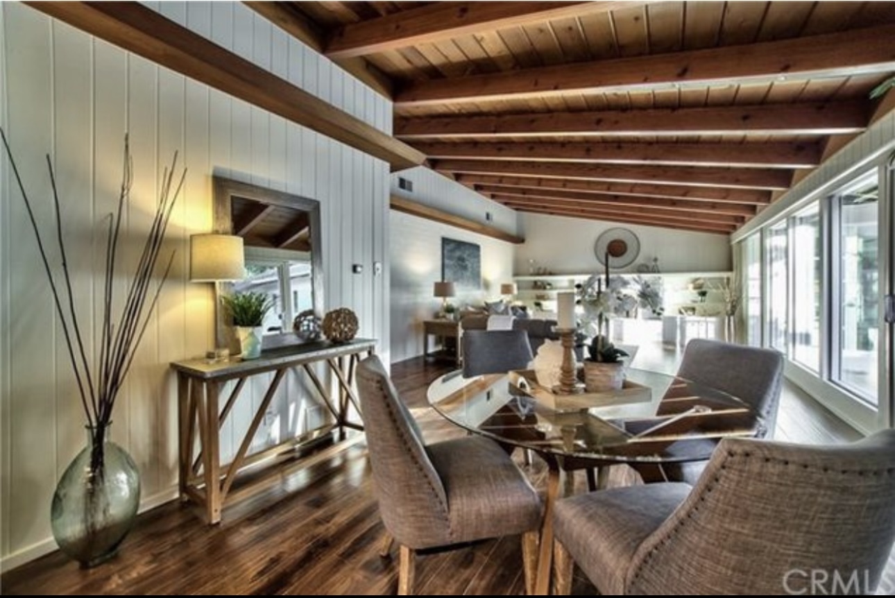 Warm entry opens to spacious living & dining with rich wood beams and natural light - 332 E Deodar St