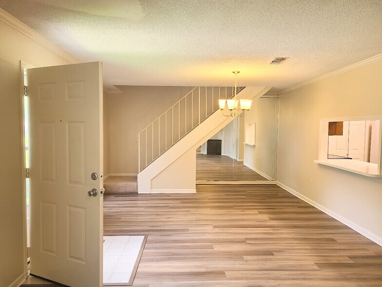 Dining room with passthrough from kitchen - 12439 Coursey Blvd