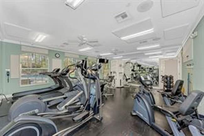 Building Photo - Elegant 3 Bedroom End-Unit Condo with Screened Lanai & Pond Views and A Private Garage
