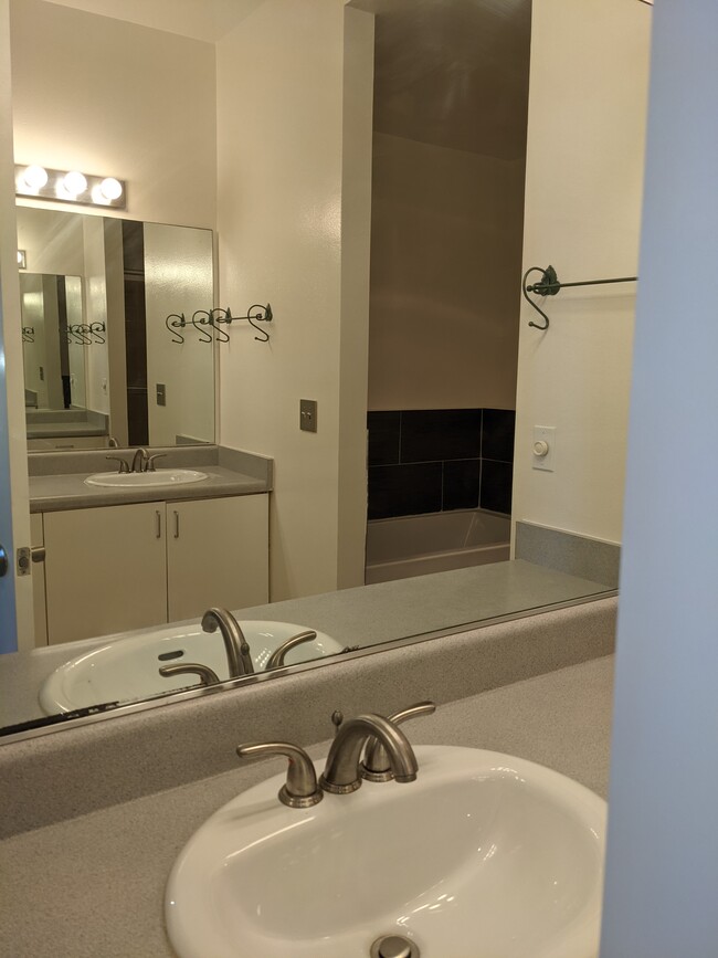 Master bathroom, two sinks, a separate shower and bath tub. - 2491 Purdue Ave