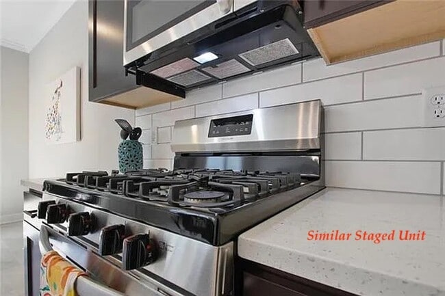 Building Photo - Stunning and Bright 3BR 2.5BA Townhome w/ 2-Car Garage • Quartzite Kitchen • Deck in Parkville