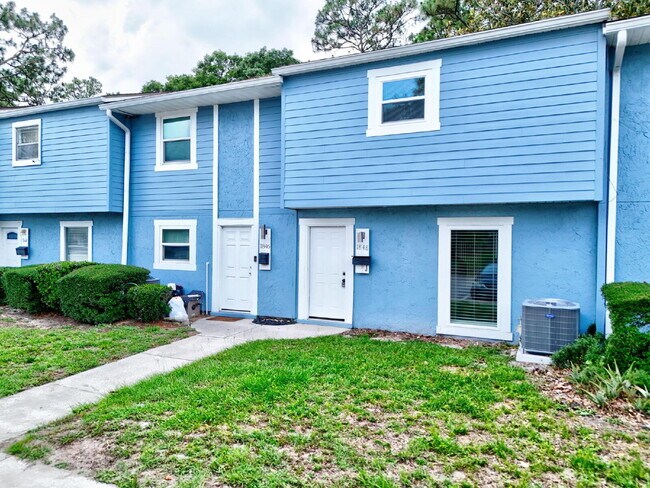 Building Photo - "Charming 2-Bedroom Townhouse Retreat with...
