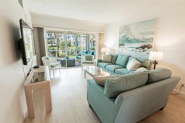 Building Photo - AVAILABLE NOW! Furnished Ground-Floor End Unit | Lake & Pool Views | Minutes to Marco Island & Do...