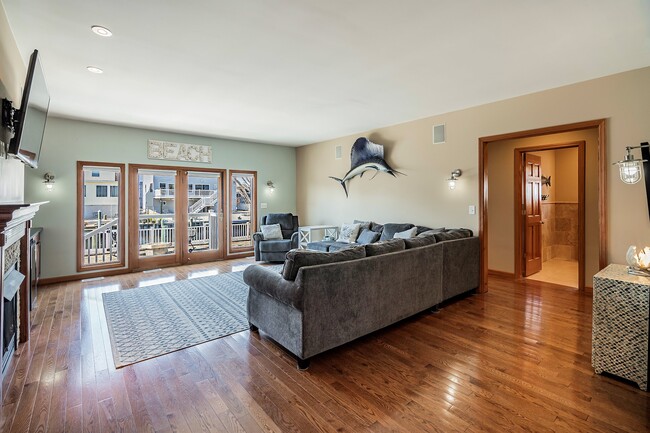 Livingroom w/ french doors to pool & Lagoon - 18 Halsey Dr