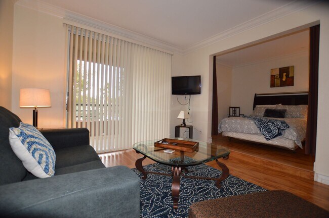 Building Photo - Charming Furnished Studio with Large Patio...