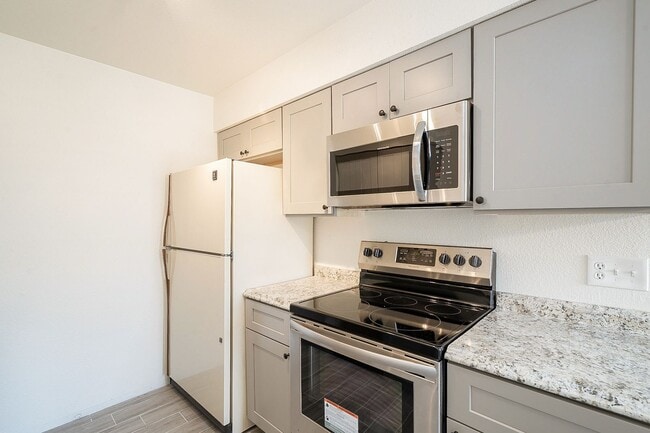 Building Photo - Updated home with large backyard & 2 car g...