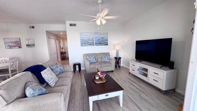 Building Photo - Elevated Luxury at The Terraces – 4th Floor Lake & Golf Course Views! 55+ Community!