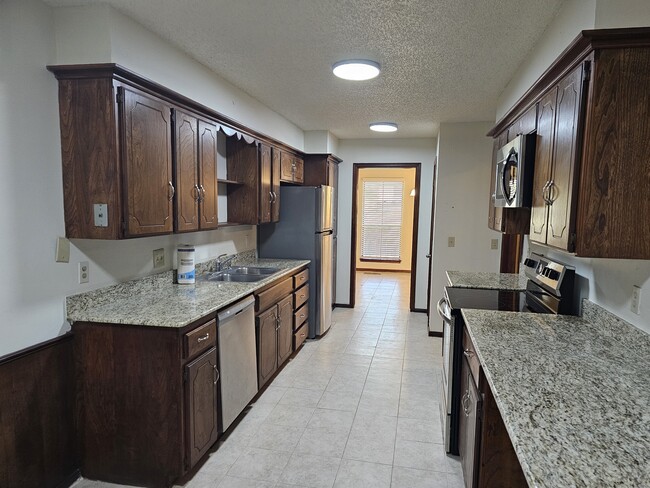 Kitchen with granite counter tops - 2104 NW 118th Ter