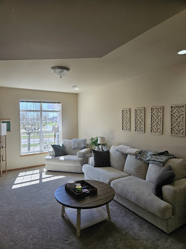 Living Room with tons of natural light - 4874 Innovation Dr