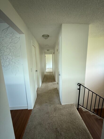 Hallway facing bathroom, master bedroom, bedrooms 2 and 3 - 13016 16th St NE