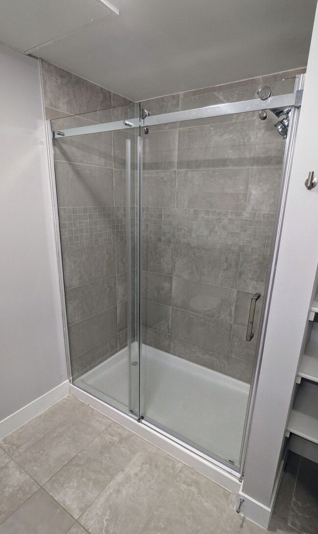 New glass shower door - 1898 S Bannock St