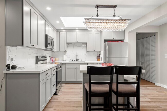 Fully stocked kitchen with massive skylight to add to the openness. - 4206 N Winnifred St