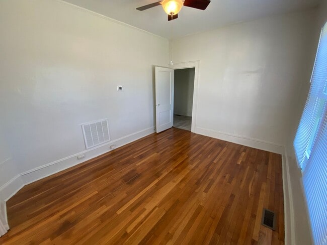 Building Photo - Huge Trinity Park Duplex with Office, Shared Fenced Yard and Adorable Porch!