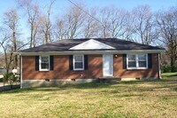 Building Photo - 4 Bedroom and 2 Bath home with large yard