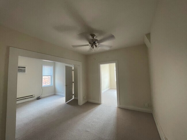 As you enter the door into the apartment - two living spaces & 2 bedrooms all have new carpet - 109 N 3rd St